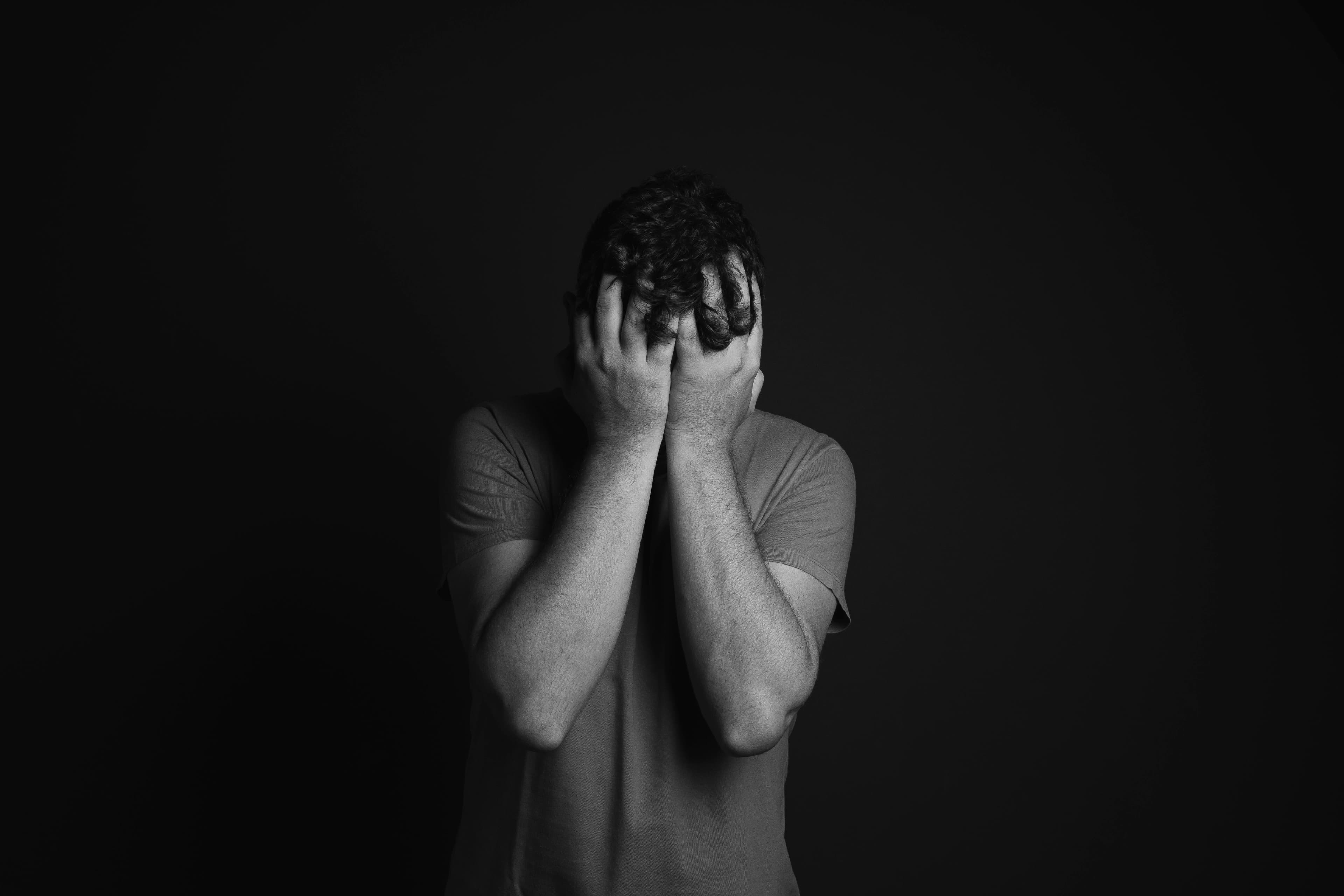 A person pausing quietly while managing persistent worry