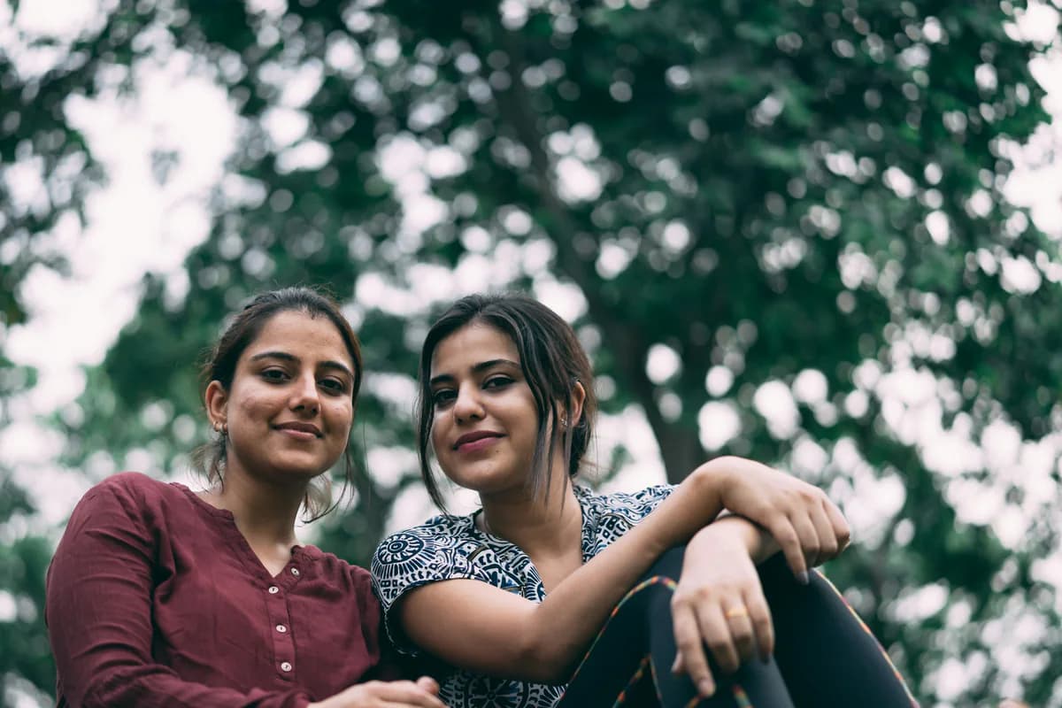 Two people sitting together outdoors