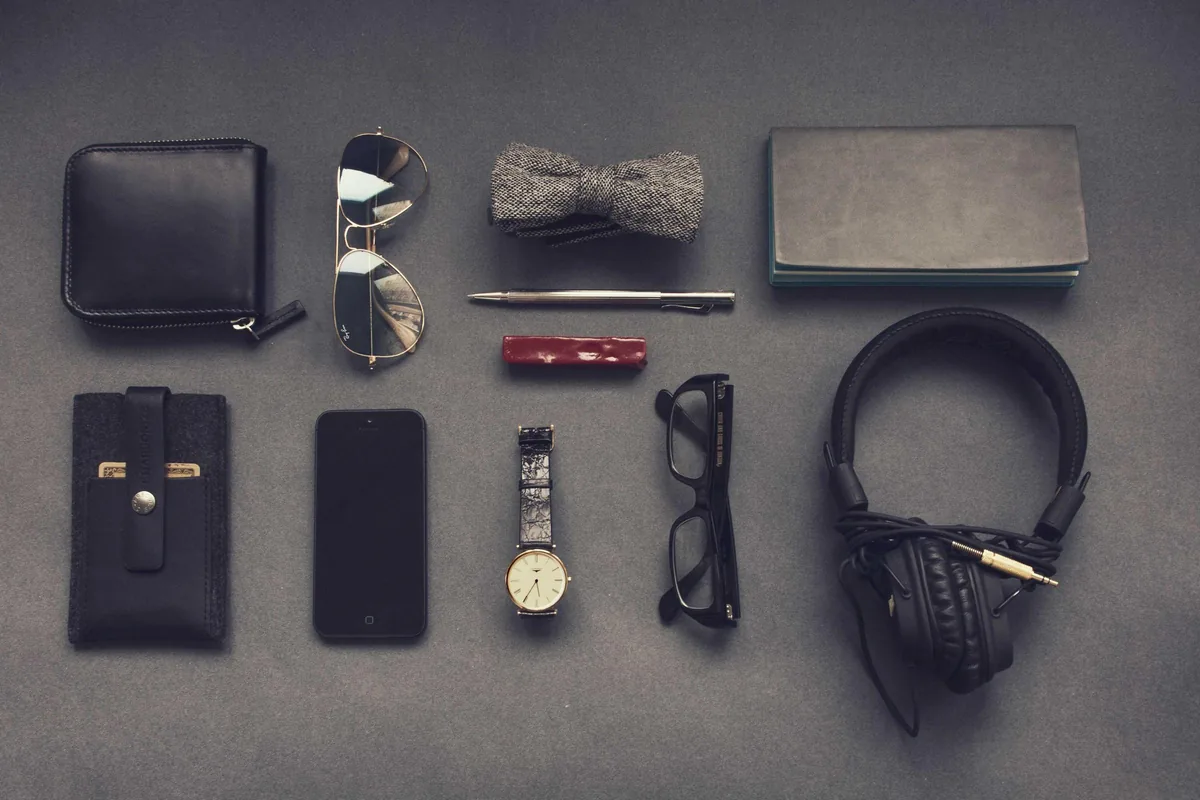 Everyday carry items — wallet, watch and keys — laid out neatly